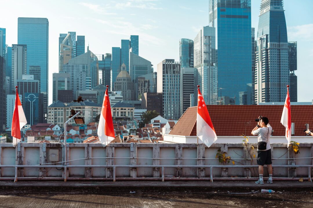 A boy is taking pictures of Singapore city's