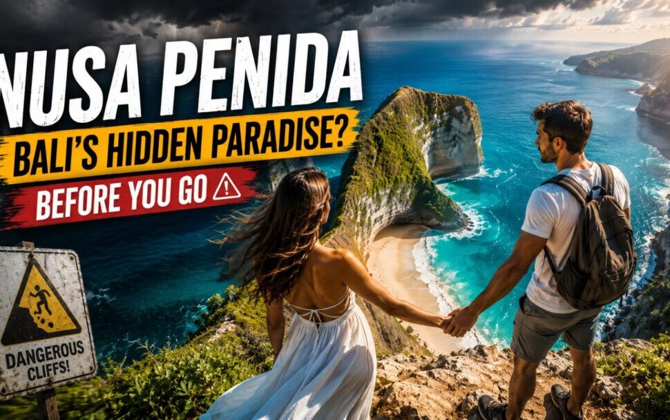 Couple standing on a cliff holding hands above a turquoise beach, with bold travel banner and a 'Dangerous Cliffs' sign nearby (Nusa Penida).