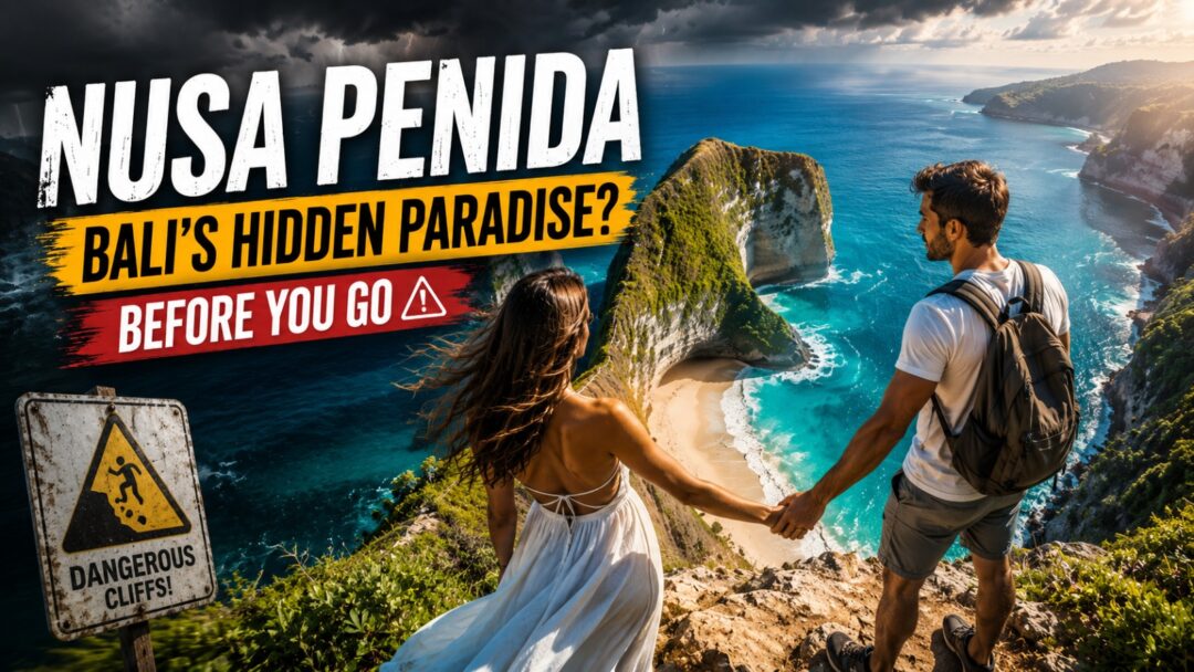 Couple standing on a cliff holding hands above a turquoise beach, with bold travel banner and a 'Dangerous Cliffs' sign nearby (Nusa Penida).