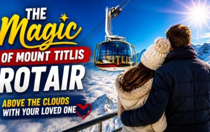 The Magic of Mount Titlis Rotair: Above the Clouds with Your Loved One › Forever Tourism LLC Couple with their backs to the camera watch the Titlis Rotair gondola above snowy mountains under a bright blue sky.