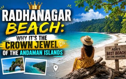 Radhanagar Beach: Why It's the Crown Jewel of the Andaman Islands › Forever Tourism LLC Thumbnail for a travel article: Radhanagar Beach—crown jewel of the Andaman Islands, with a woman in a sunhat sitting on the shore.